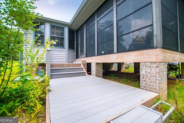 65 Pine Haven Ct, Carrollton, GA 30116 - wooden deck featuring a sunroom