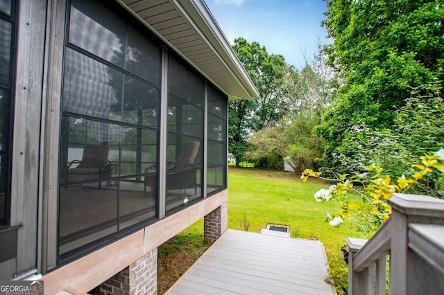 65 Pine Haven Ct, Carrollton, GA 30116 - wooden deck featuring a sunroom and a yard