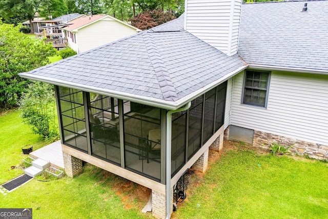 65 Pine Haven Ct, Carrollton, GA 30116 - exterior view of a shingled roof, a chimney, a downspout, and gutters