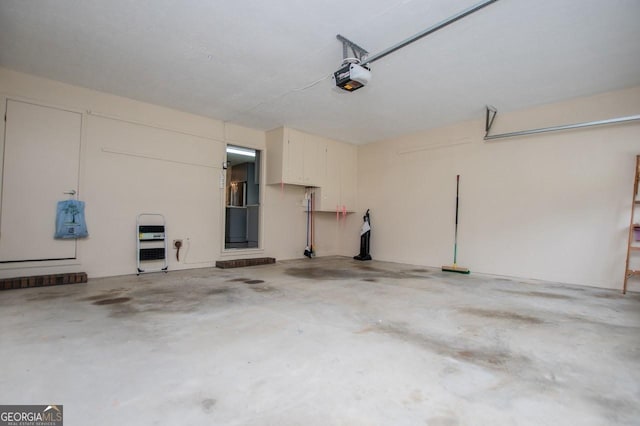 65 Pine Haven Ct, Carrollton, GA 30116 - garage with a garage door opener and heating unit
