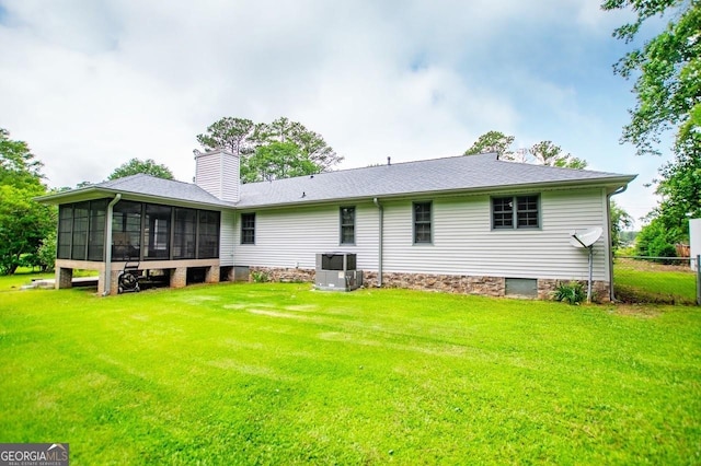 65 Pine Haven Ct, Carrollton, GA 30116 - rear view of property with a sunroom, a chimney, and central AC