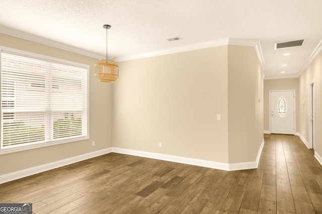 308 Laurel Landing Blvd, Kingsland, GA 31548 - empty room with dark wood finished floors, baseboards, and crown molding