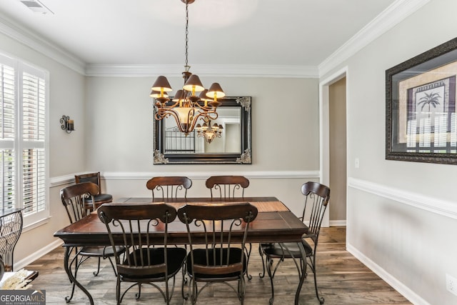 2624 E Madison Dr, Atlanta, GA 30360 - dining room featuring ornamental molding, a chandelier, wood finished floors, and baseboards