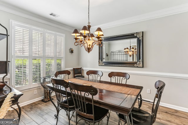 2624 E Madison Dr, Atlanta, GA 30360 - dining room with a chandelier, healthy amount of natural light, wood finished floors, crown molding, and baseboards