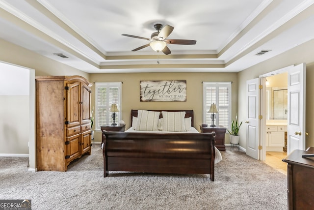 2624 E Madison Dr, Atlanta, GA 30360 - bedroom featuring a raised ceiling, light colored carpet, multiple windows, crown molding, and baseboards