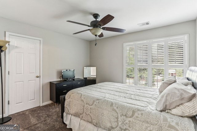 2624 E Madison Dr, Atlanta, GA 30360 - bedroom with dark carpet, a ceiling fan, and baseboards