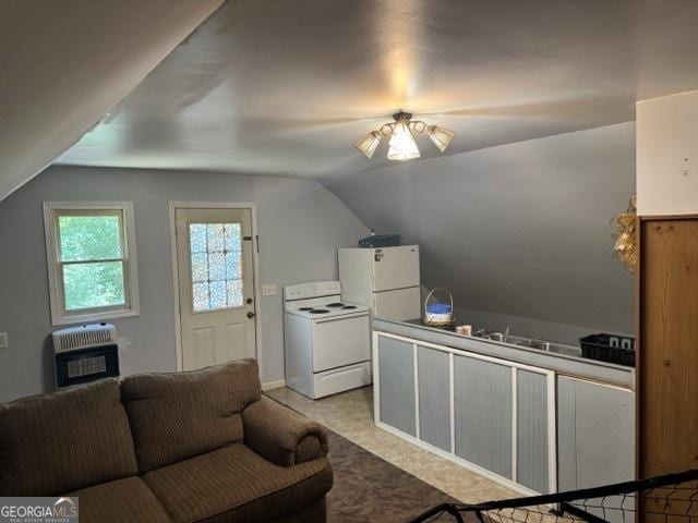 650 N Raburn Rd, Bremen, GA 30110 - kitchen with white appliances, heating unit, and lofted ceiling