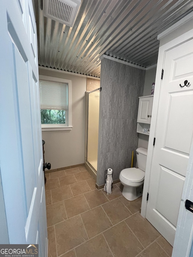 54 Candy Land Dr, Cleveland, GA 30528 - bathroom featuring toilet, a shower stall, and tile patterned floors