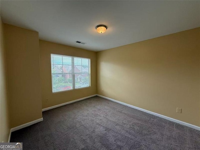 102 Daisy Cir, Mcdonough, GA 30252 - spare room featuring carpet flooring and baseboards