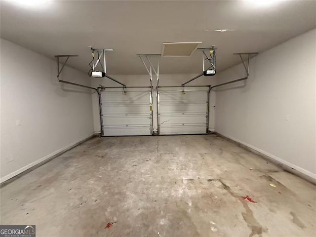 102 Daisy Cir, Mcdonough, GA 30252 - garage featuring a garage door opener and baseboards