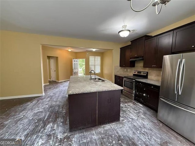 102 Daisy Cir, Mcdonough, GA 30252 - kitchen featuring stainless steel appliances, under cabinet range hood, a sink, and dark wood-type flooring