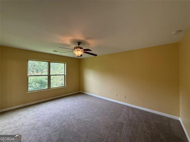 102 Daisy Cir, Mcdonough, GA 30252 - carpeted empty room featuring ceiling fan, baseboards, and a smoke detector