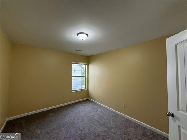 102 Daisy Cir, Mcdonough, GA 30252 - spare room featuring baseboards and dark carpet