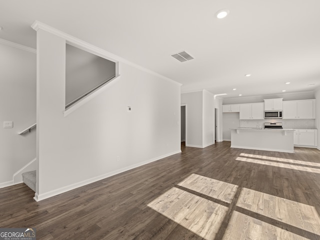 525 King Vlg, Braselton, GA 30517 - unfurnished living room featuring crown molding, stairway, dark wood finished floors, recessed lighting, and baseboards