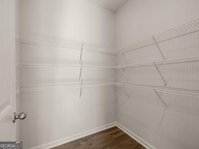 525 King Vlg, Braselton, GA 30517 - walk in closet with dark wood-style floors