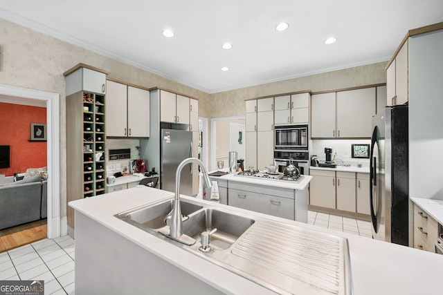 5105 Jett Forest Trl NW, Sandy Springs, GA 30327 - kitchen with appliances with stainless steel finishes, light tile patterned floors, crown molding, a center island, and light countertops