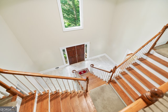 5105 Jett Forest Trl NW, Sandy Springs, GA 30327 - stairs with a high ceiling and wood finished floors