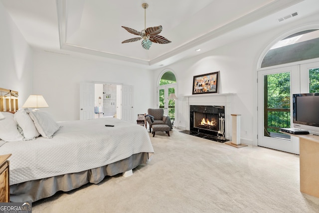 5105 Jett Forest Trl NW, Sandy Springs, GA 30327 - bedroom with a raised ceiling, carpet flooring, a fireplace, access to outside, and a ceiling fan