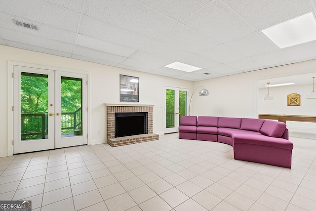 5105 Jett Forest Trl NW, Sandy Springs, GA 30327 - tiled living area with a drop ceiling, a fireplace, and french doors