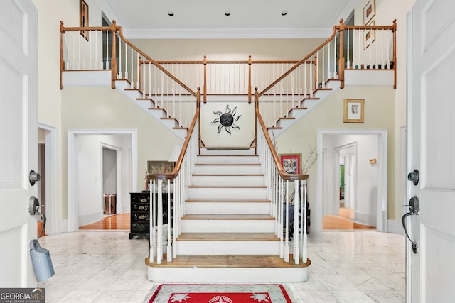 5105 Jett Forest Trl NW, Sandy Springs, GA 30327 - foyer entrance featuring marble finish flooring, stairway, a high ceiling, and ornamental molding