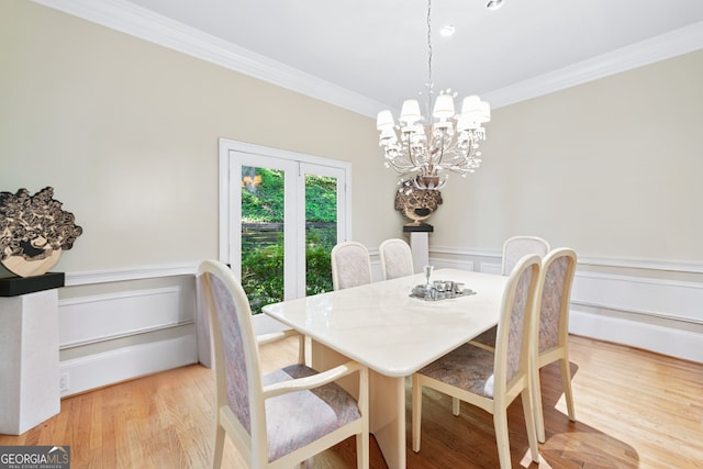 5105 Jett Forest Trl NW, Sandy Springs, GA 30327 - dining space with crown molding, a chandelier, and light wood-style flooring