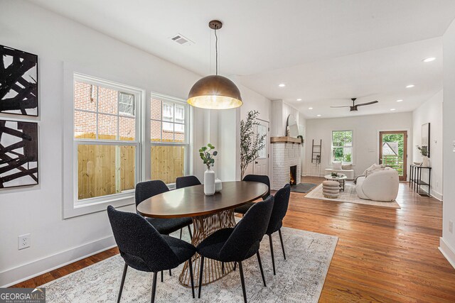 1721 S Gordon St SW, Atlanta, GA 30310 - dining space featuring a ceiling fan, wood finished floors, a brick fireplace, and recessed lighting