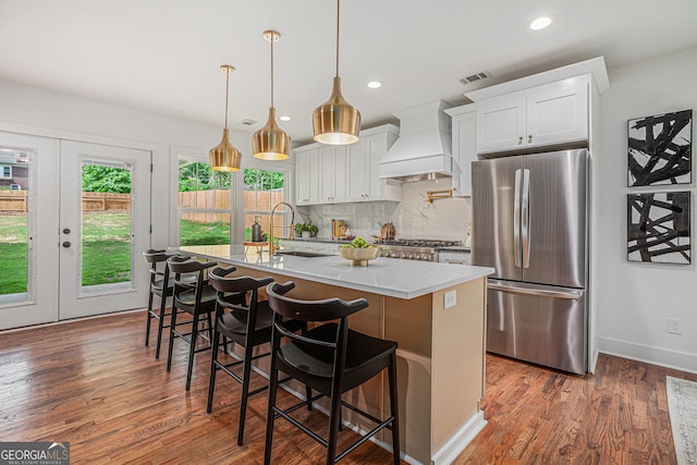 1721 S Gordon St SW, Atlanta, GA 30310 - kitchen featuring freestanding refrigerator, custom exhaust hood, plenty of natural light, an island with sink, and recessed lighting