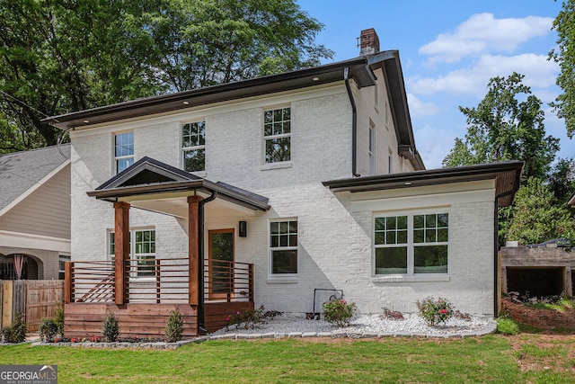 1721 S Gordon St SW, Atlanta, GA 30310 - view of front of property with a chimney, brick siding, and covered porch