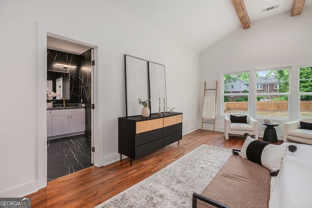 1721 S Gordon St SW, Atlanta, GA 30310 - living area featuring beamed ceiling, wood finished floors, and high vaulted ceiling