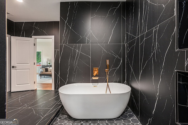 1721 S Gordon St SW, Atlanta, GA 30310 - bathroom with a freestanding bath, tile walls, and marble finish floors