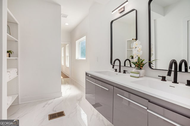 1721 S Gordon St SW, Atlanta, GA 30310 - bathroom featuring marble tiled floors, double vanity, and recessed lighting