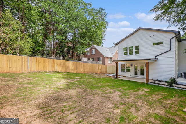 1721 S Gordon St SW, Atlanta, GA 30310 - fenced backyard featuring french doors and a patio