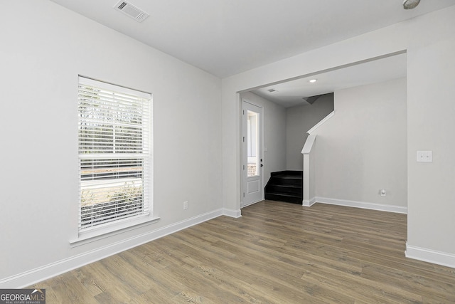 500 Cantrell Dr, Dallas, GA 30157 - empty room with stairs, plenty of natural light, wood finished floors, and recessed lighting