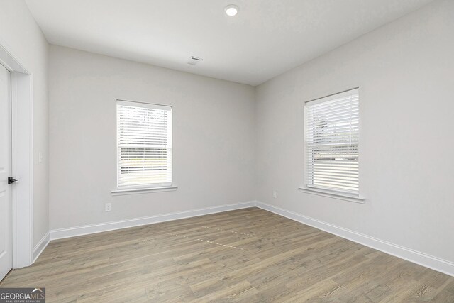 500 Cantrell Dr, Dallas, GA 30157 - unfurnished room featuring healthy amount of natural light and light wood-style floors