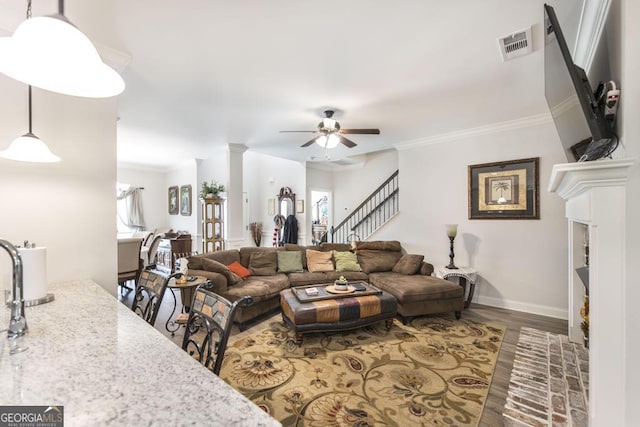 128 Arbor Crk, Warner Robins, GA 31093 - living area with stairs, ceiling fan, baseboards, crown molding, and wood finished floors