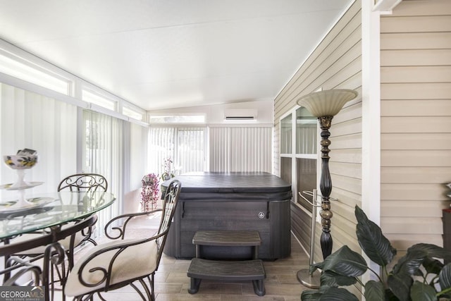 128 Arbor Crk, Warner Robins, GA 31093 - sunroom with a hot tub, an AC wall unit, outdoor dining area, and lofted ceiling