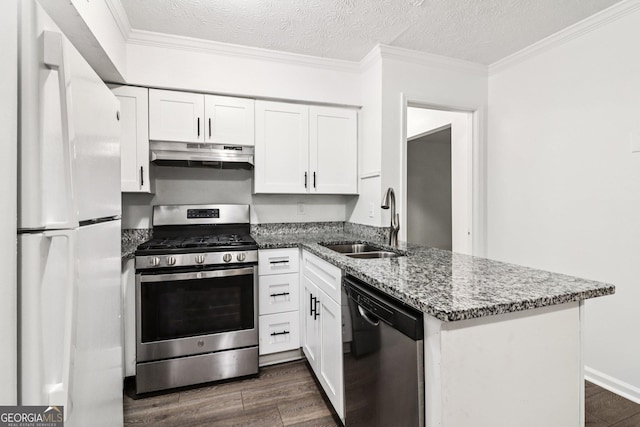 1931 Brian Way, Decatur, GA 30033 - kitchen with dishwasher, freestanding refrigerator, stainless steel range with gas cooktop, under cabinet range hood, and a peninsula