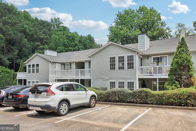 1931 Brian Way, Decatur, GA 30033 - view of front of house with a chimney, uncovered parking, and a shingled roof
