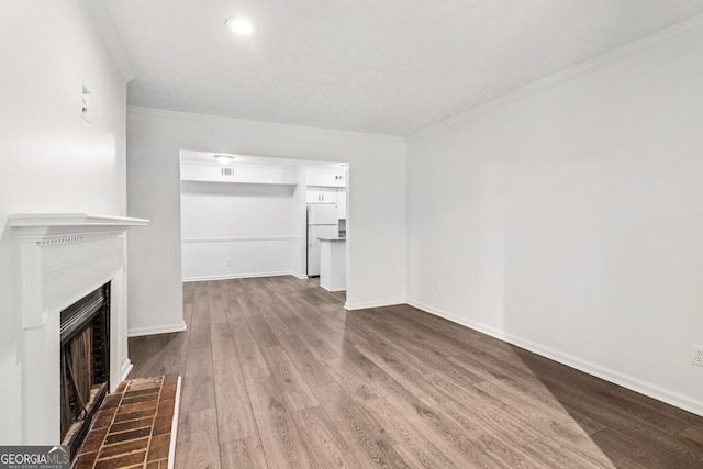 1931 Brian Way, Decatur, GA 30033 - unfurnished living room with ornamental molding, wood finished floors, a fireplace with flush hearth, and recessed lighting