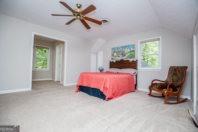 3187 Oak Grove Church Rd, Carrollton, GA 30117 - bedroom with multiple windows, carpet floors, a ceiling fan, vaulted ceiling, and baseboards