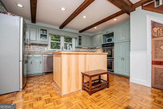 3187 Oak Grove Church Rd, Carrollton, GA 30117 - kitchen featuring stainless steel appliances, open shelves, green cabinetry, beamed ceiling, and decorative backsplash