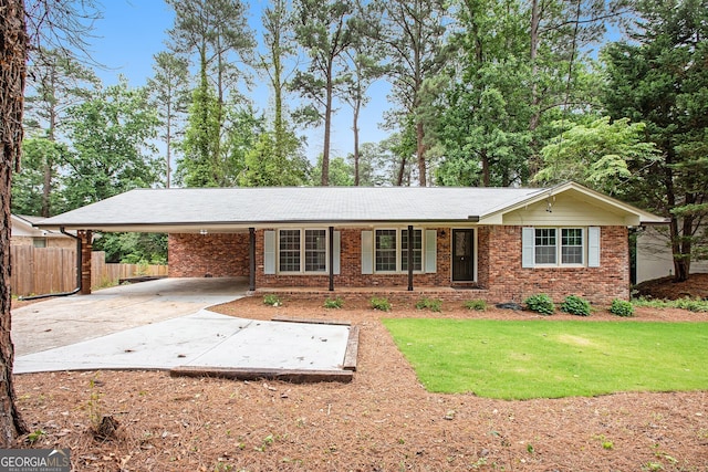 2695 Peeler Rd, Dunwoody, GA 30360 - ranch-style house with an attached carport, brick siding, and driveway