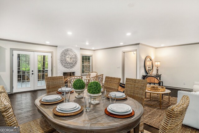2695 Peeler Rd, Dunwoody, GA 30360 - dining area featuring ornamental molding, wood finished floors, a fireplace, french doors, and recessed lighting
