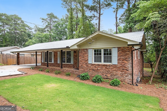 2695 Peeler Rd, Dunwoody, GA 30360 - ranch-style home featuring concrete driveway, an attached carport, and brick siding