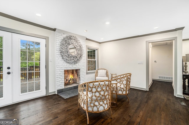 2695 Peeler Rd, Dunwoody, GA 30360 - living area with crown molding, wood finished floors, baseboards, a fireplace, and recessed lighting