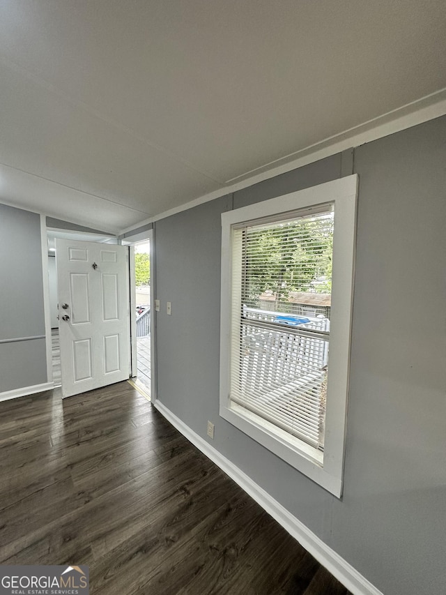 19 Poole Cir, Ellenwood, GA 30294 - entrance foyer featuring dark wood-style flooring and baseboards