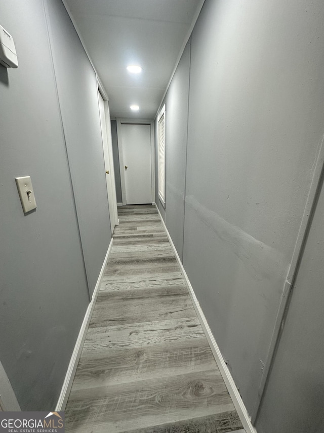19 Poole Cir, Ellenwood, GA 30294 - hall with light wood-type flooring, baseboards, and recessed lighting