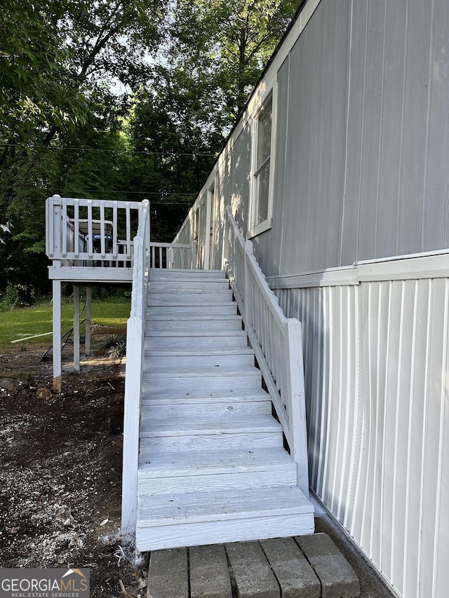 19 Poole Cir, Ellenwood, GA 30294 - stairway with view of wooded area