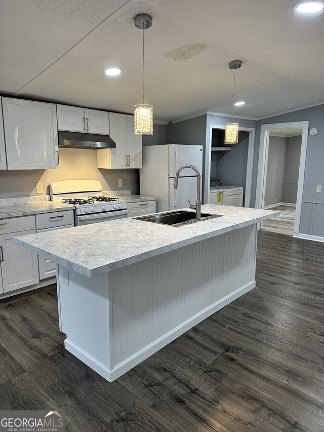 19 Poole Cir, Ellenwood, GA 30294 - kitchen with under cabinet range hood, white appliances, separate washer and dryer, a sink, and dark wood finished floors