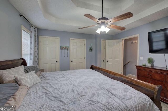 62 Lazy Water Dr SW, Cartersville, GA 30120 - bedroom with a ceiling fan and multiple closets